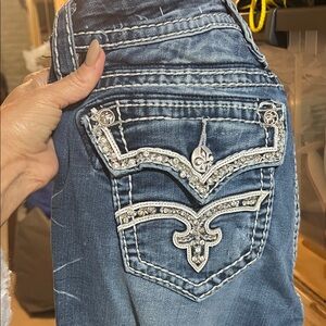Rock Revival Distressed Blue Jeans with Embellished Pockets